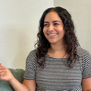 marcela gallegos smiling mid conversation
