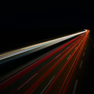 Red and White Light streaks on freeway in the dark