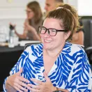 photo of Lauren smiling and talking