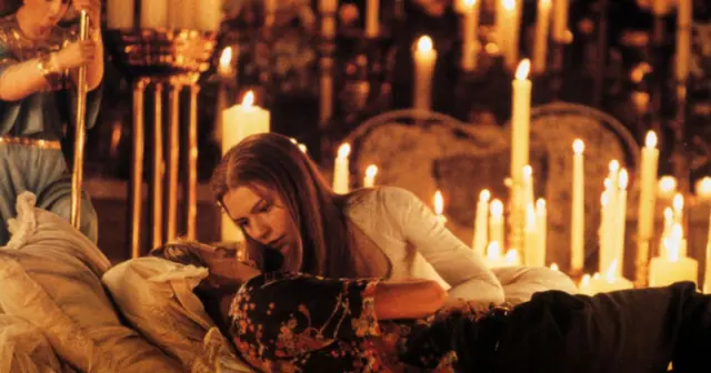 Juliet awakens to find Romeo in her tomb